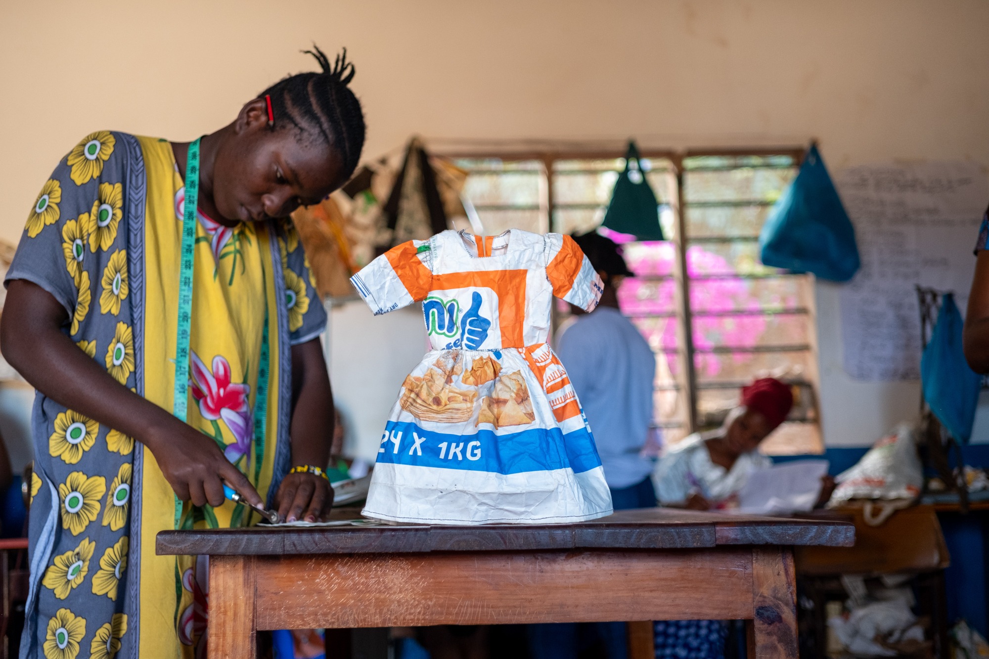 In order to pass their national sewing exam, the girls must know how to effectively read a pattern to create an article of clothing.  The articles of clothing they create are valuable learning tools and made from flour bags in order to save on costs.