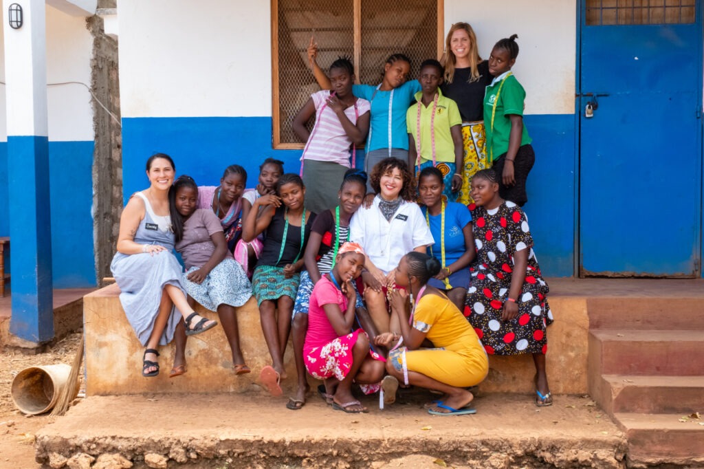 Group Photo with students from left to right Sandy (Creative Director), Cindy (Founder), and Shannon (Board Member)